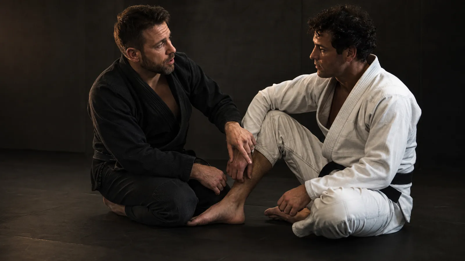 A coach and student talking through a position during a one-on-one session